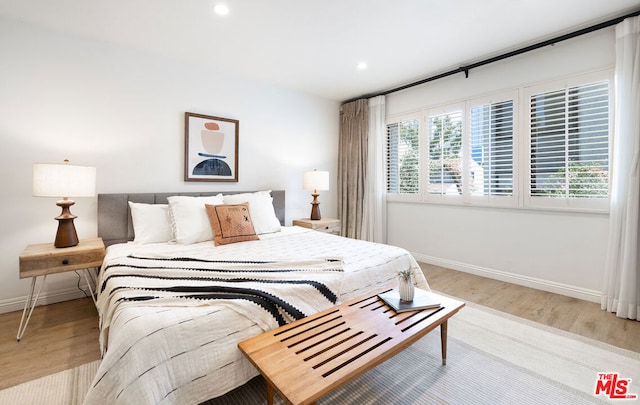 bedroom with light wood-type flooring