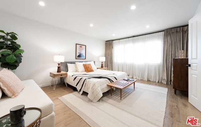 bedroom with light hardwood / wood-style flooring