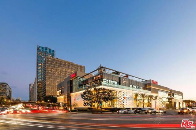 view of outdoor building at dusk