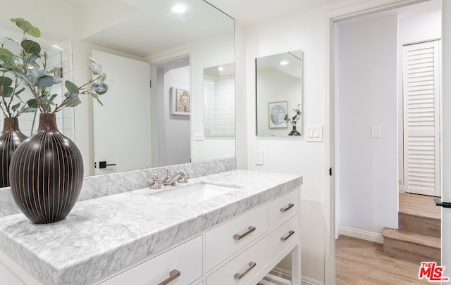 bathroom featuring vanity and wood-type flooring