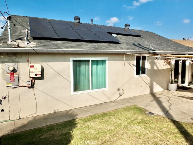 view of home's exterior with solar panels