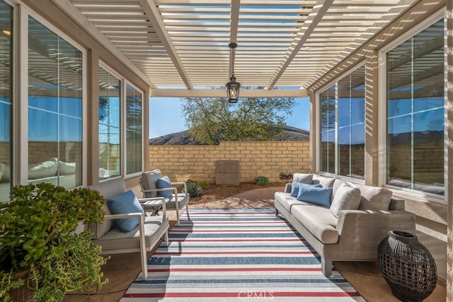 view of patio / terrace featuring a pergola and an outdoor hangout area