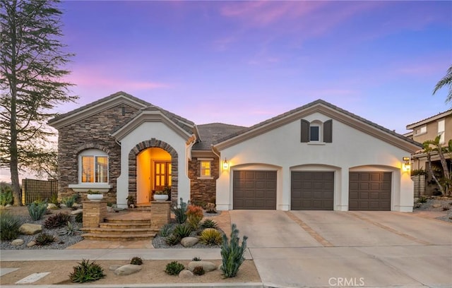 view of front of home with a garage