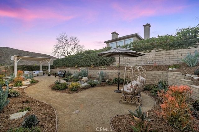 view of patio terrace at dusk