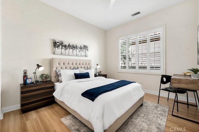 bedroom with hardwood / wood-style floors