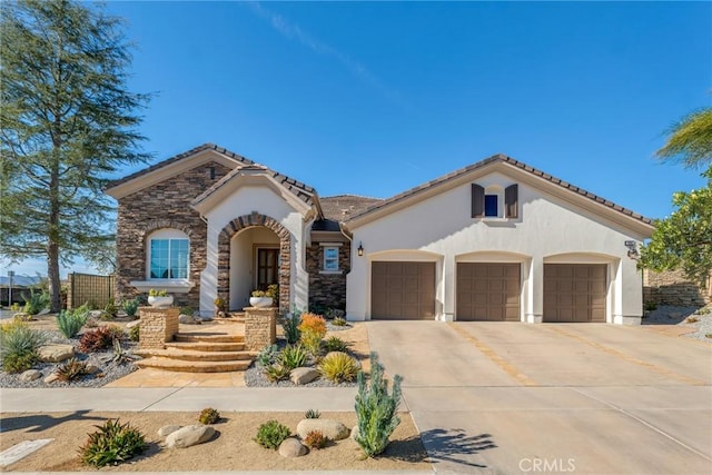 mediterranean / spanish-style home with a garage