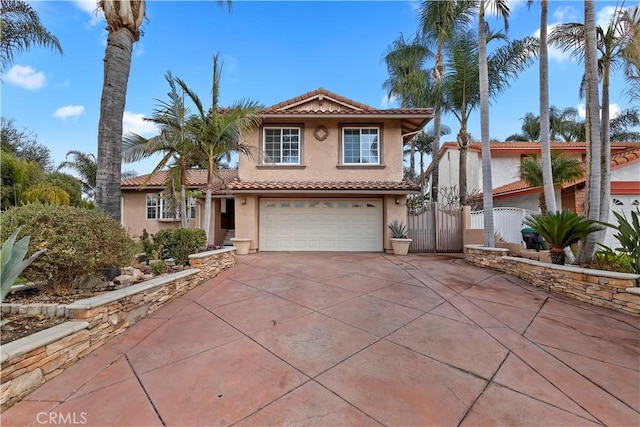 mediterranean / spanish house featuring a garage