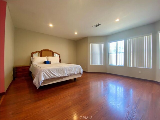 bedroom featuring dark wood-type flooring