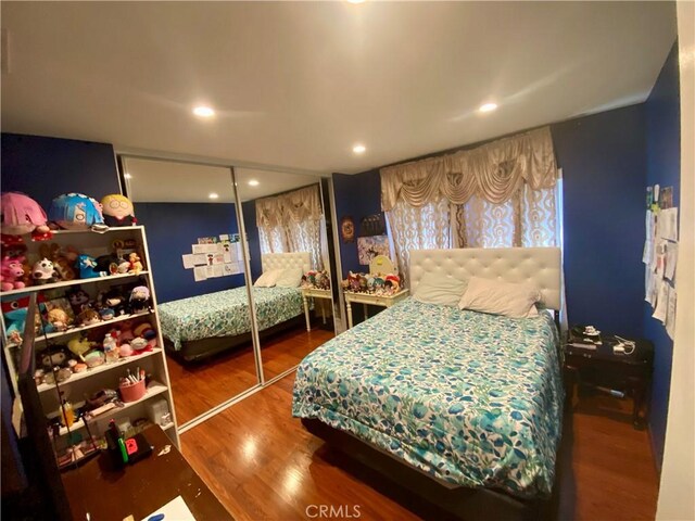 bedroom featuring wood-type flooring