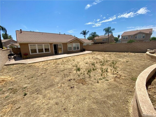 rear view of house with a patio area