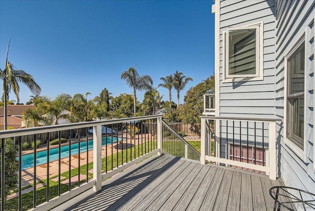 deck with a fenced in pool