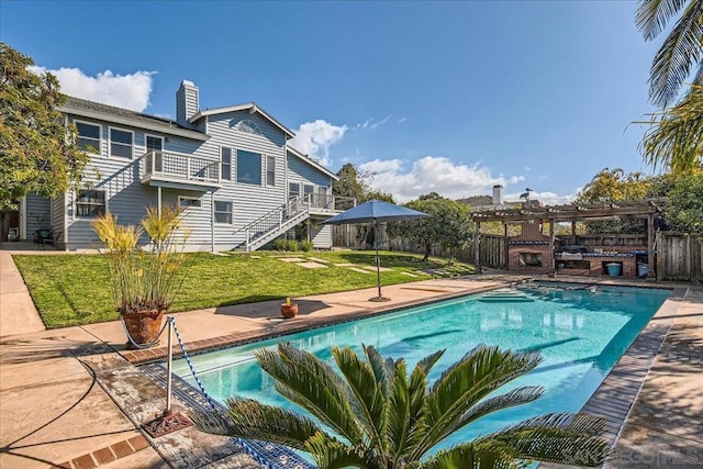 view of swimming pool with a lawn and a patio area