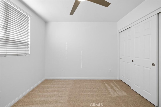 interior space with ceiling fan