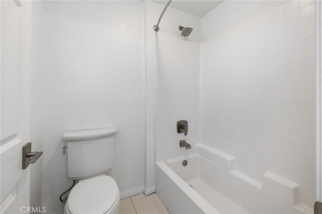 bathroom with shower / washtub combination and toilet