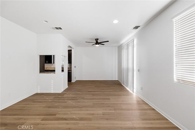 interior space featuring hardwood / wood-style flooring and ceiling fan