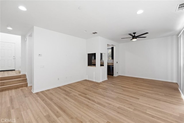 unfurnished living room featuring light hardwood / wood-style floors and ceiling fan