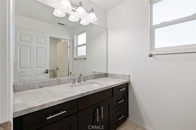 bathroom with vanity and tile patterned flooring