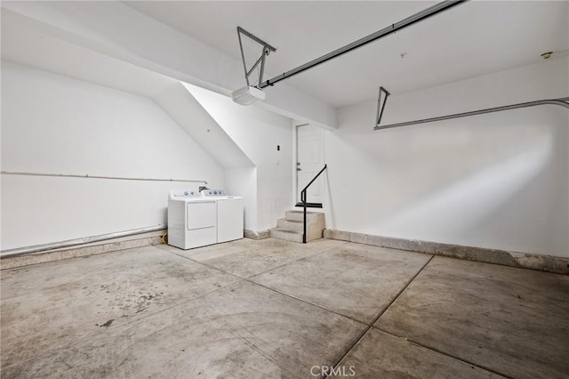 garage featuring a garage door opener and washer and clothes dryer