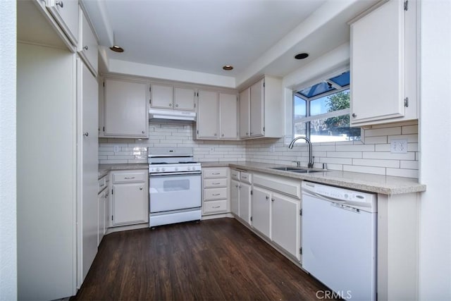 kitchen with sink, white appliances, white cabinetry, dark hardwood / wood-style floors, and decorative backsplash