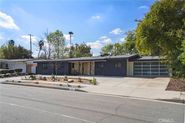 ranch-style home featuring a garage