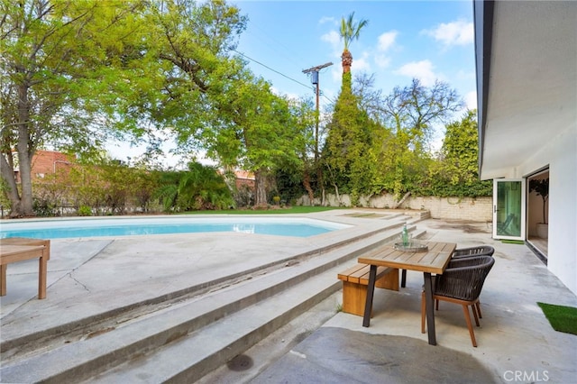 view of pool featuring a patio