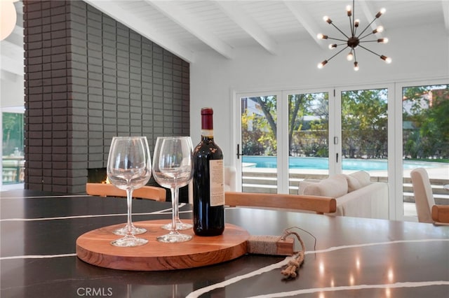 interior space with an inviting chandelier and beam ceiling