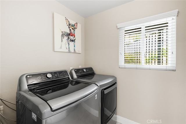 laundry room with washer and dryer