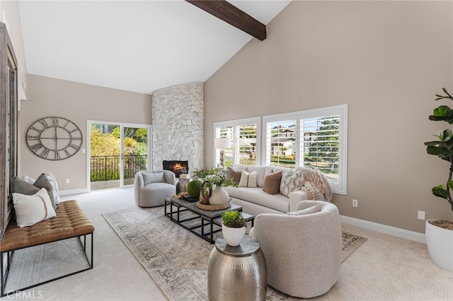 living room featuring high vaulted ceiling, a wealth of natural light, beamed ceiling, light colored carpet, and a fireplace