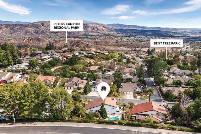 birds eye view of property featuring a mountain view