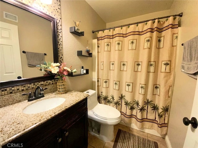 bathroom featuring curtained shower, vanity, decorative backsplash, tile patterned floors, and toilet