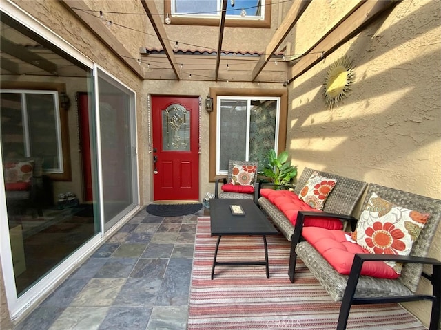 doorway to property with a patio area