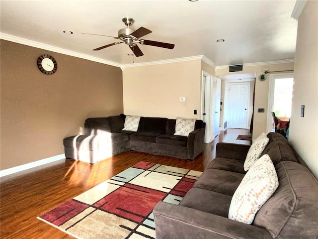 living room featuring ornamental molding, ceiling fan, and dark hardwood / wood-style flooring