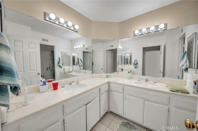 bathroom featuring tile patterned floors and vanity