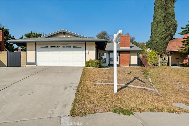 ranch-style house featuring a garage