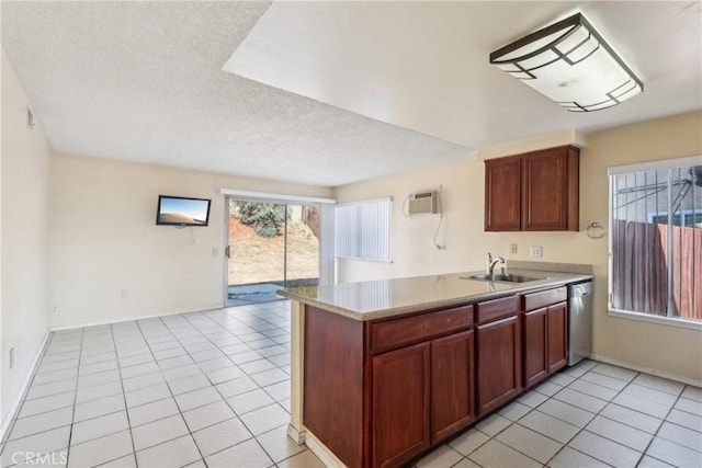 kitchen featuring a wall mounted AC, sink, stainless steel dishwasher, and light tile patterned floors