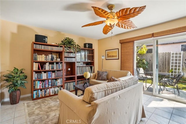 sitting room featuring ceiling fan and light tile patterned floors