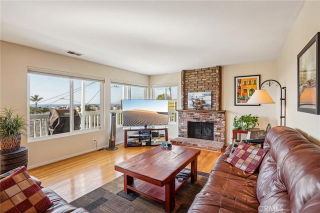 living room featuring hardwood / wood-style flooring and a fireplace