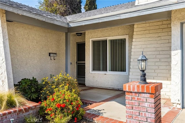 property entrance with a patio