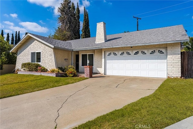 ranch-style house featuring a garage and a front lawn