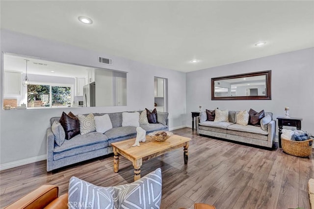 living room with light hardwood / wood-style floors