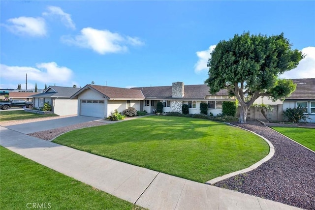 ranch-style home featuring a garage and a front yard