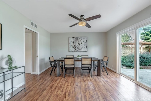 dining area featuring ceiling fan and hardwood / wood-style floors