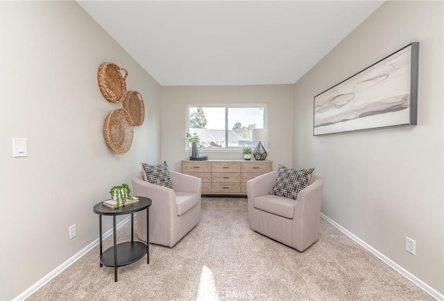 living area with light carpet