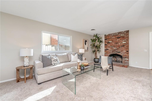 living room with a brick fireplace and light colored carpet