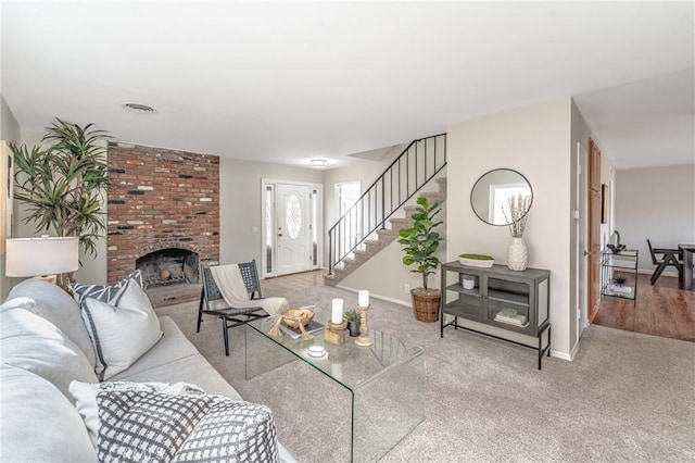 carpeted living room featuring a brick fireplace