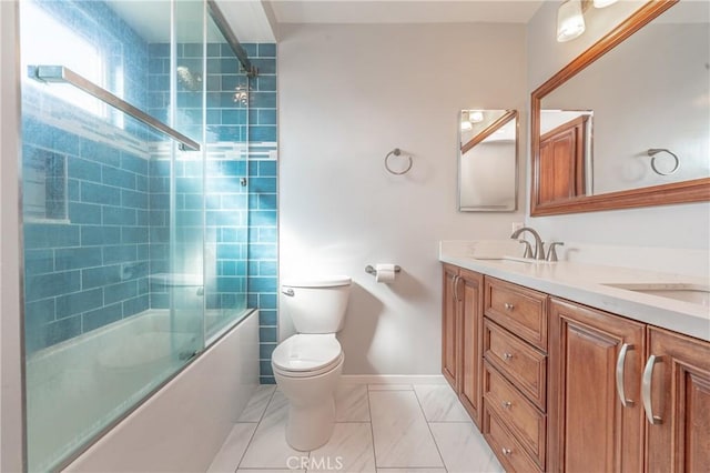 full bathroom with vanity, toilet, and combined bath / shower with glass door