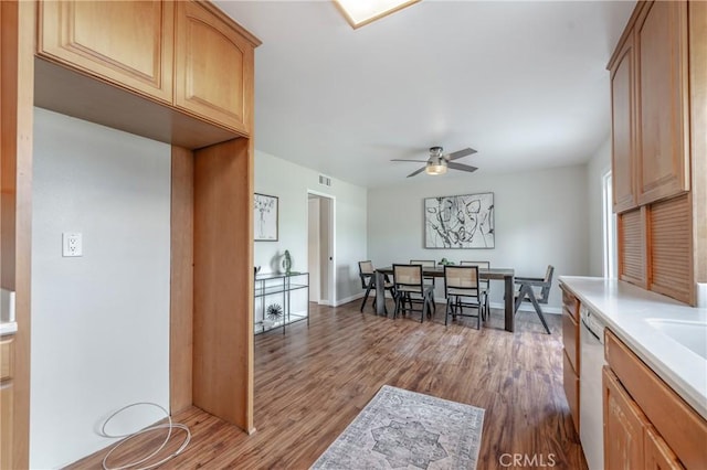 interior space featuring white dishwasher, dark hardwood / wood-style floors, and ceiling fan