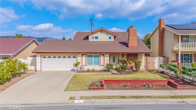 view of front of property with a garage and a front yard