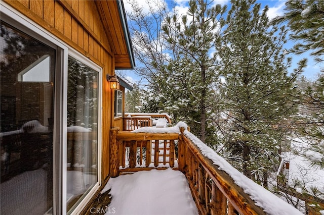 wooden balcony featuring a deck