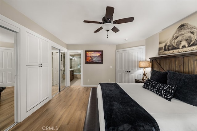 bedroom featuring connected bathroom, hardwood / wood-style flooring, and ceiling fan